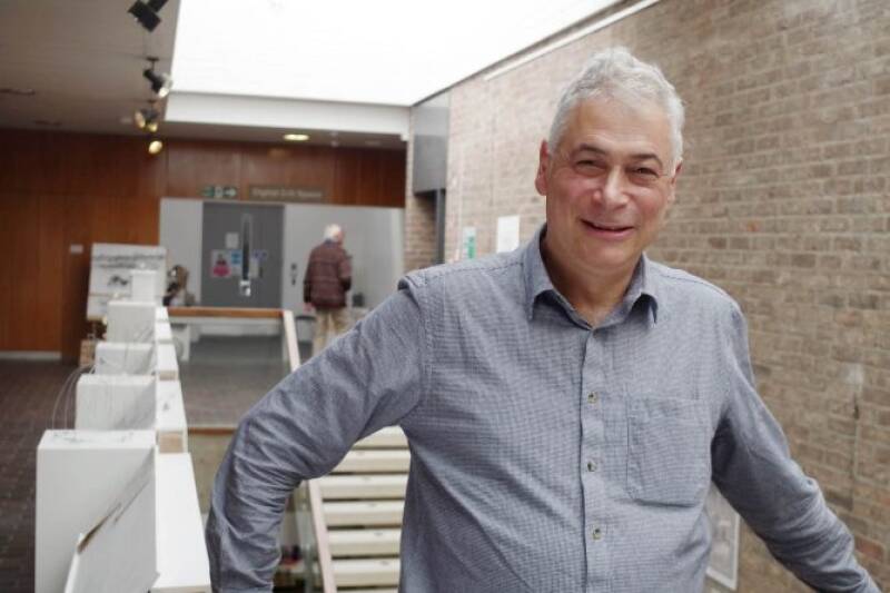 Professor Gerald Adler smiles in the Marlowe building.