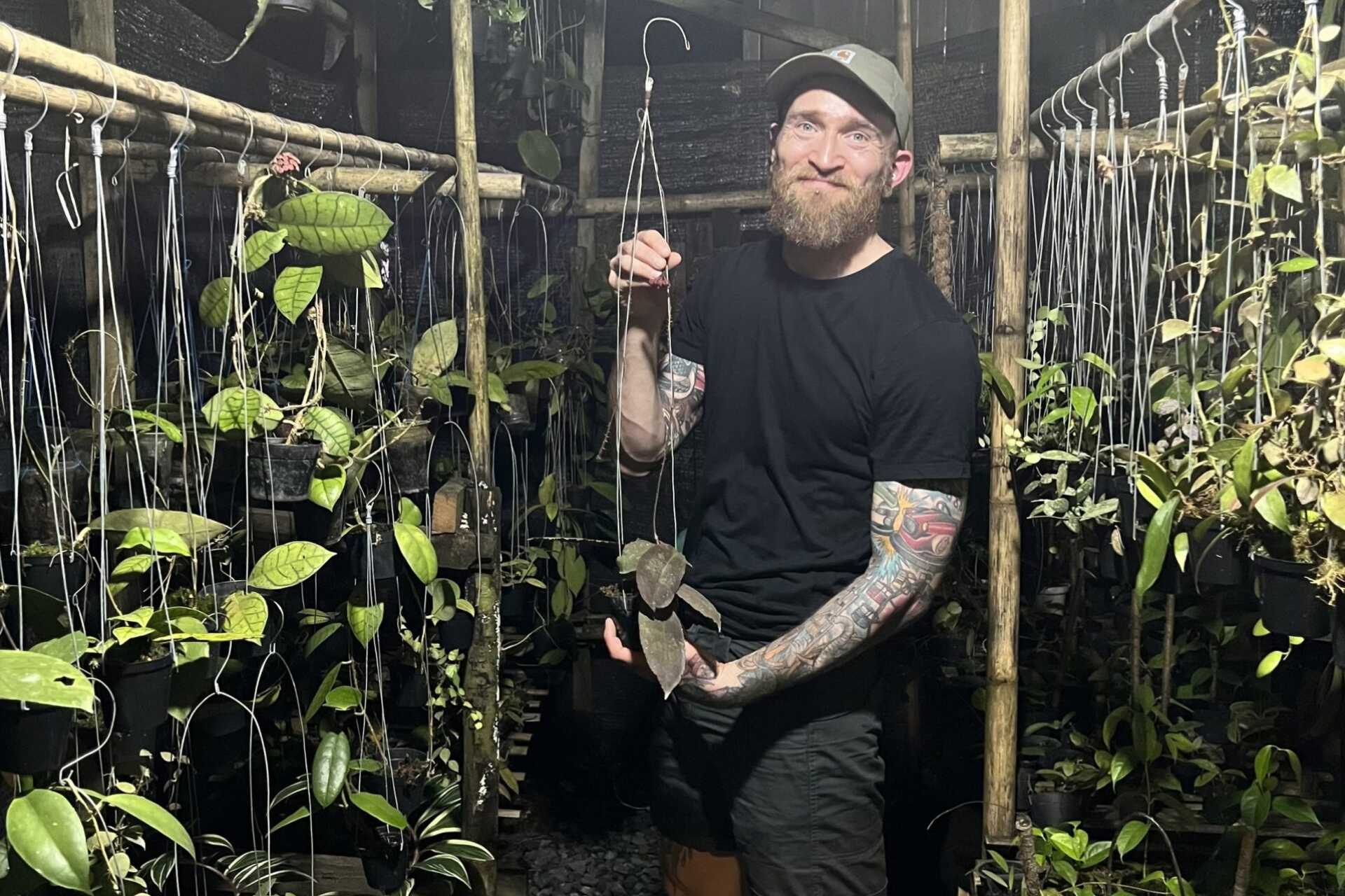 Fraser Cook poses with ornamental plants