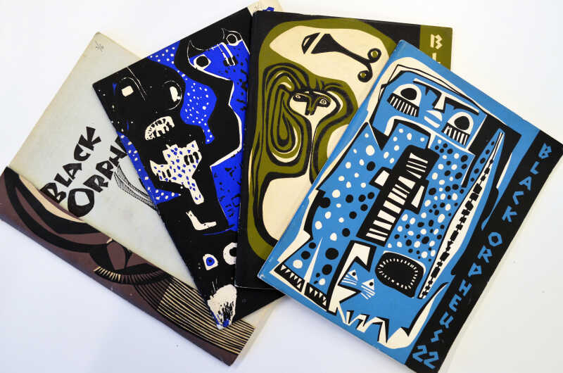 A photograph of four copies of Black Orpheus periodical.