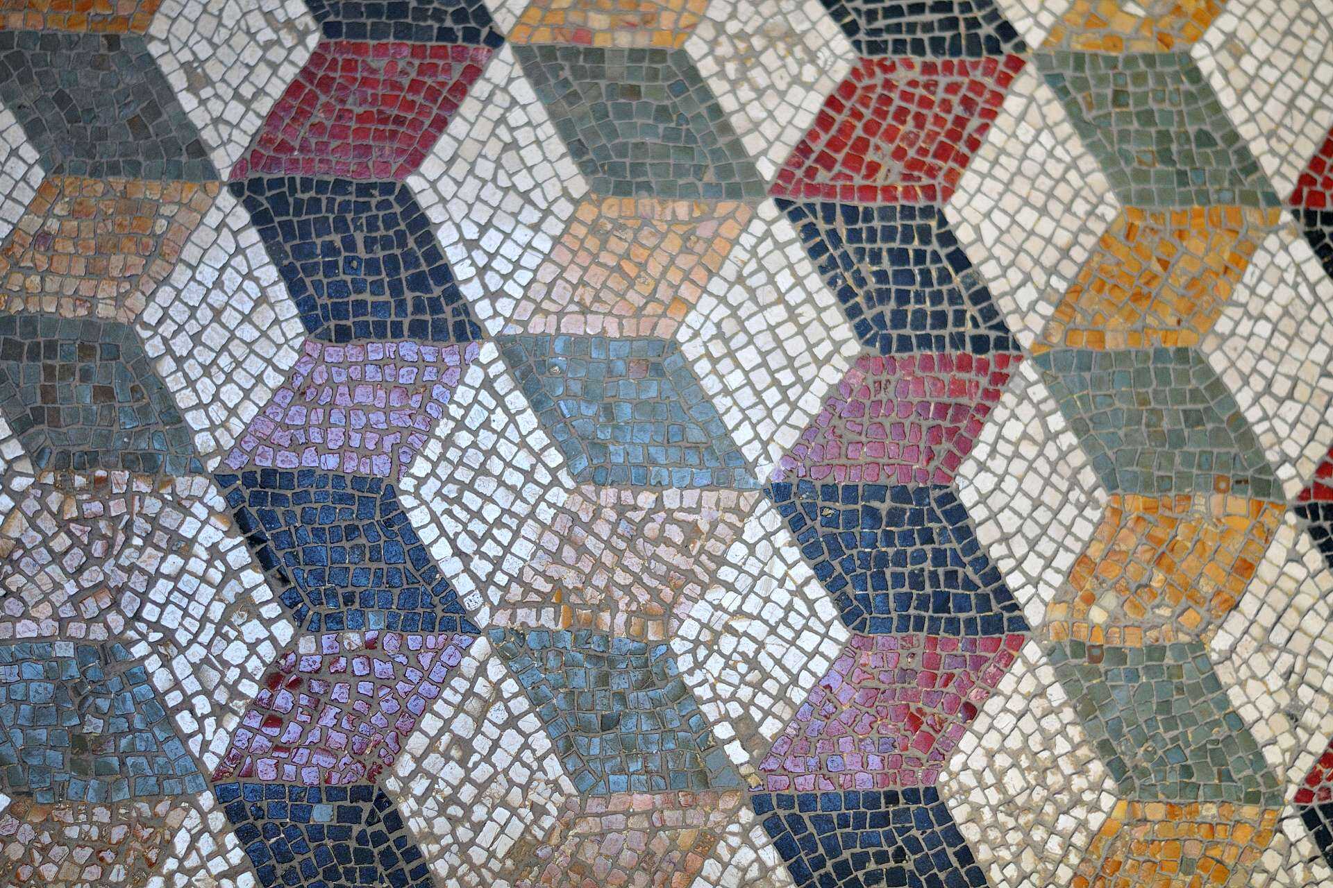 Antique Roman mosaic tiles in blue, green, red and yellow