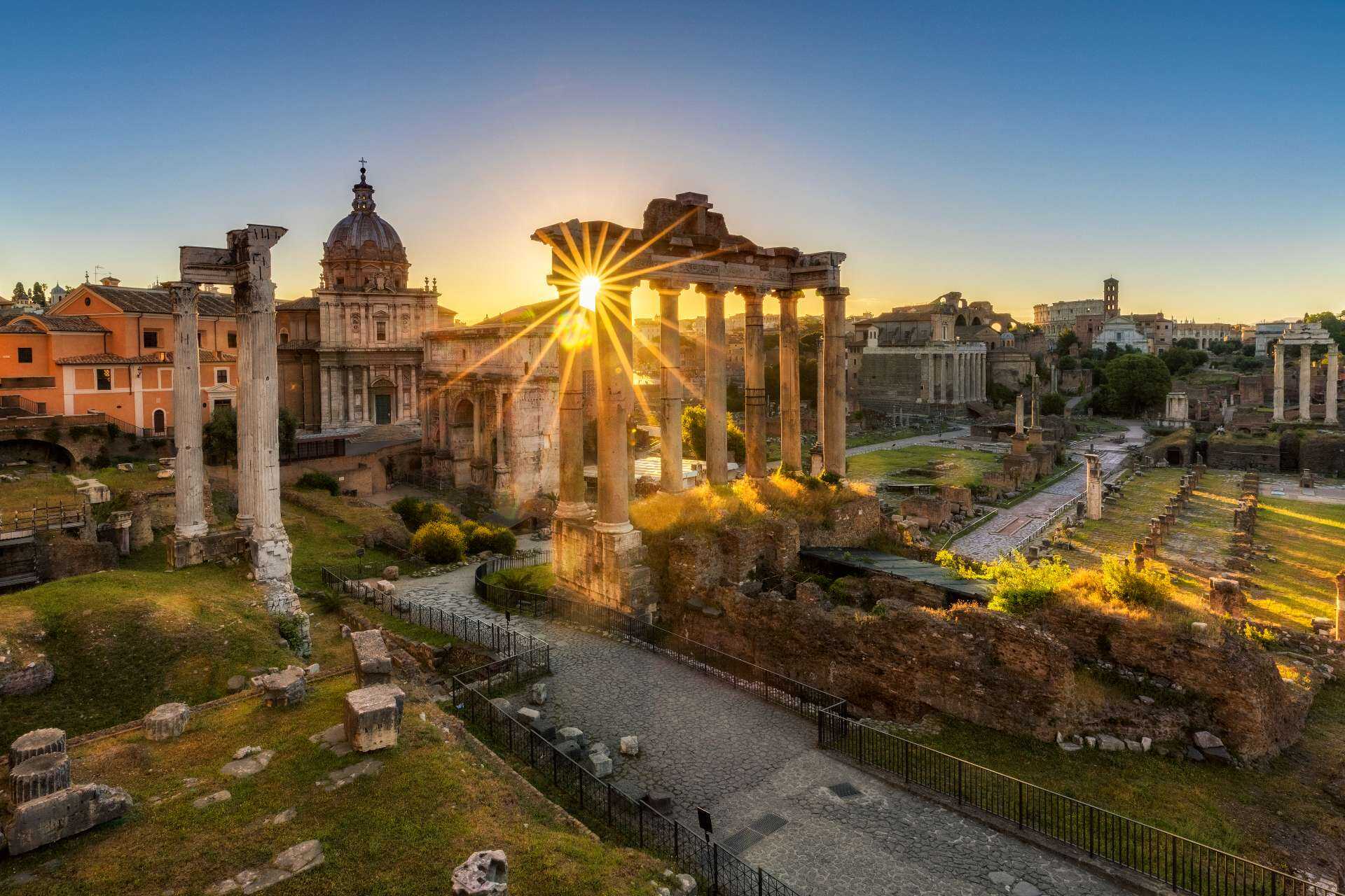 The Temple of Saturn by sunrise at Roman Forum, Rome