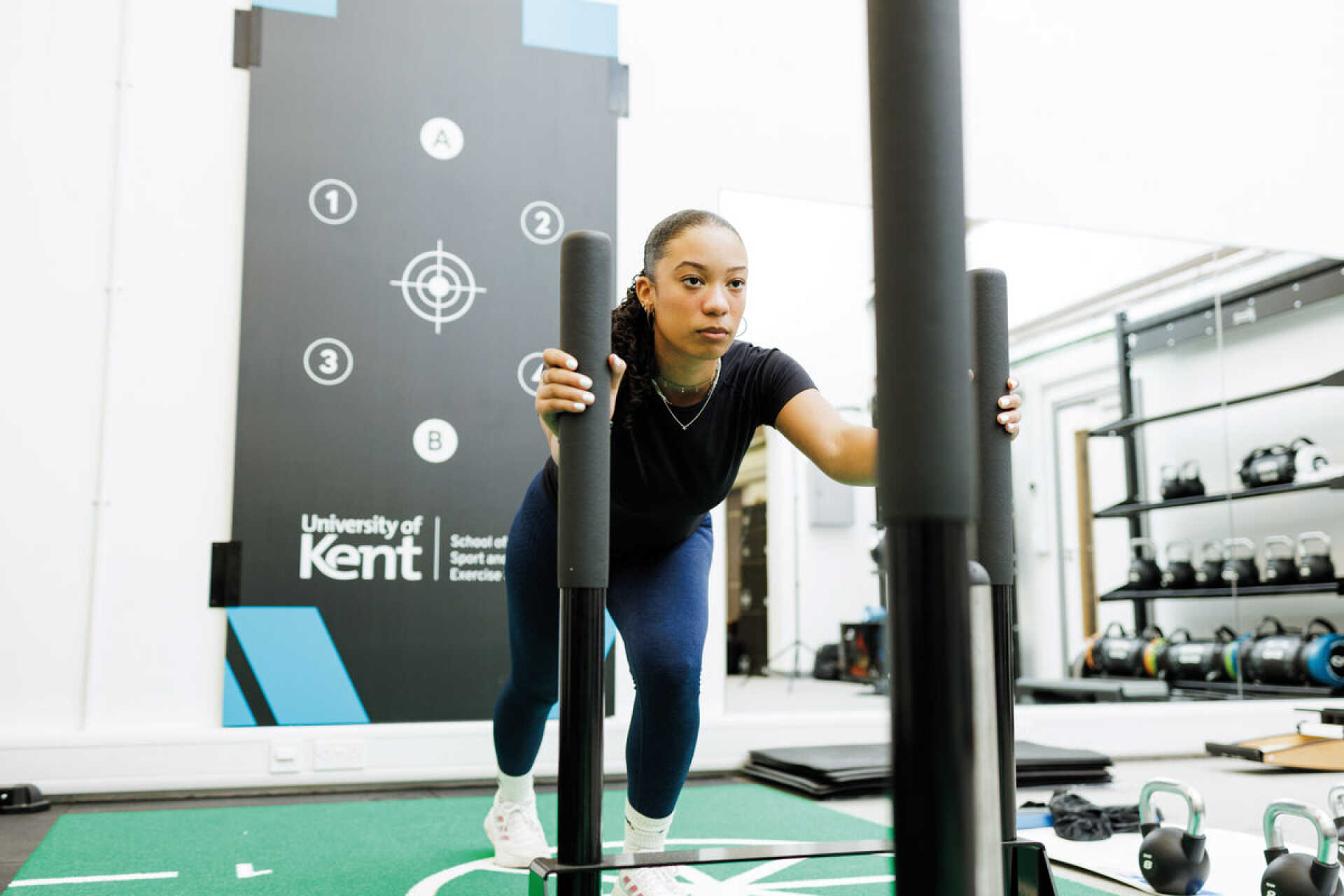 A student using sports gym equipment