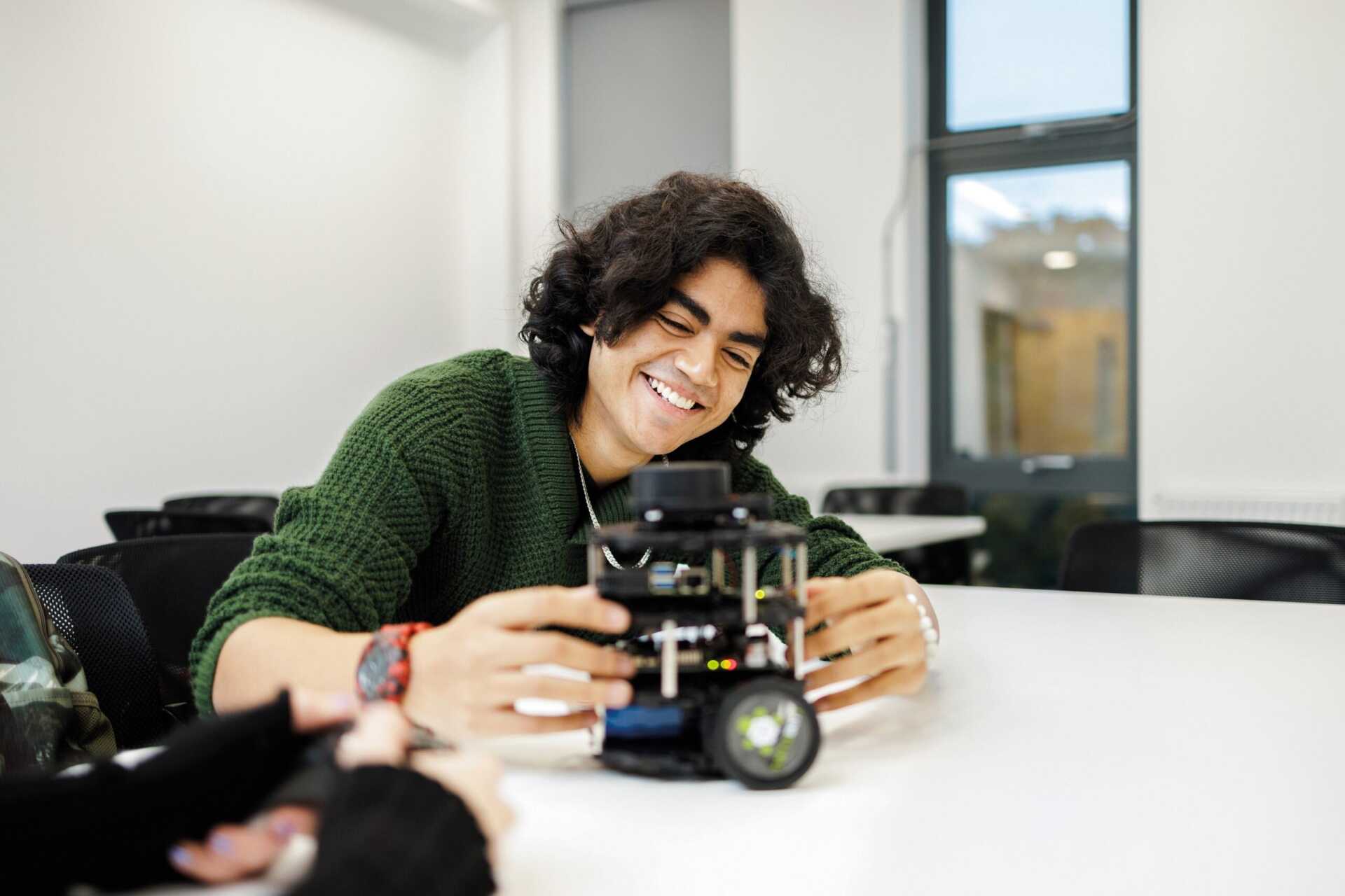 A student working on a robot.