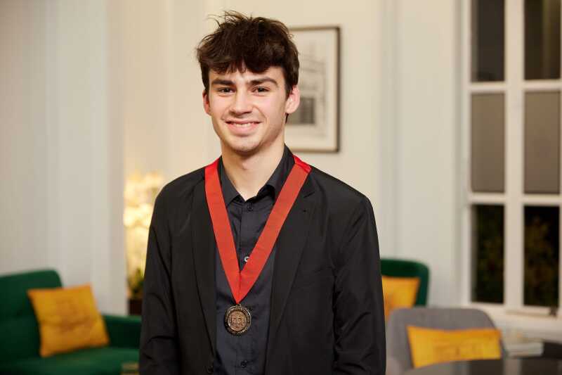 Architecture student Victor Williams Salmeron wearing his RIBA medal