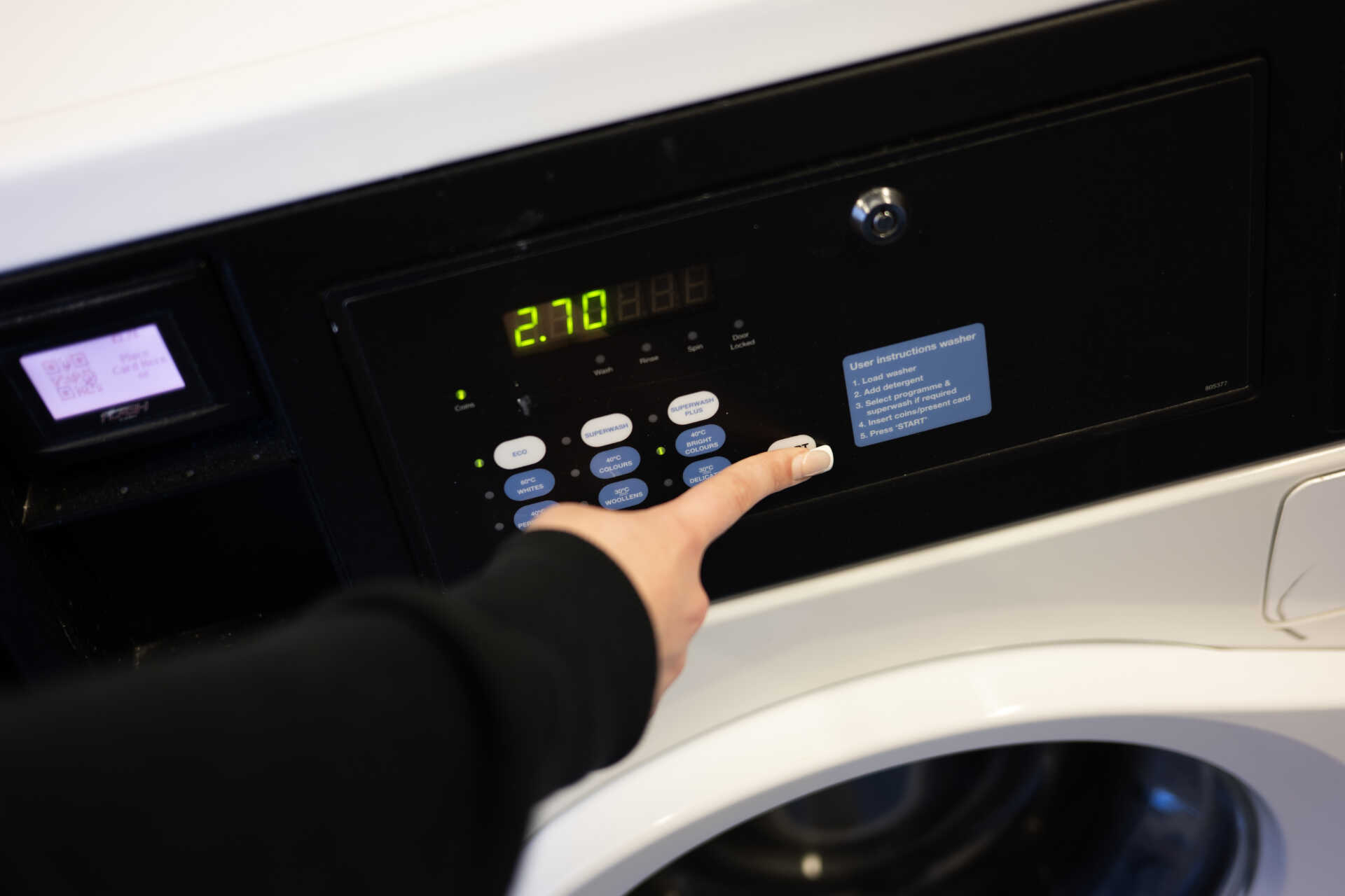 Male student using laundry