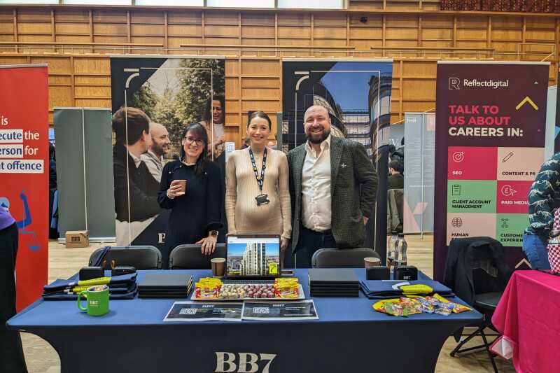 Happy exhibitors waiting for students to arrive