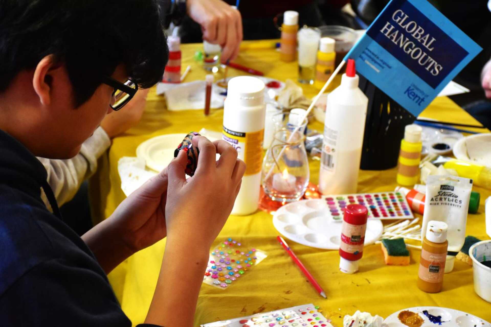 Student doing crafts at Global Hangout