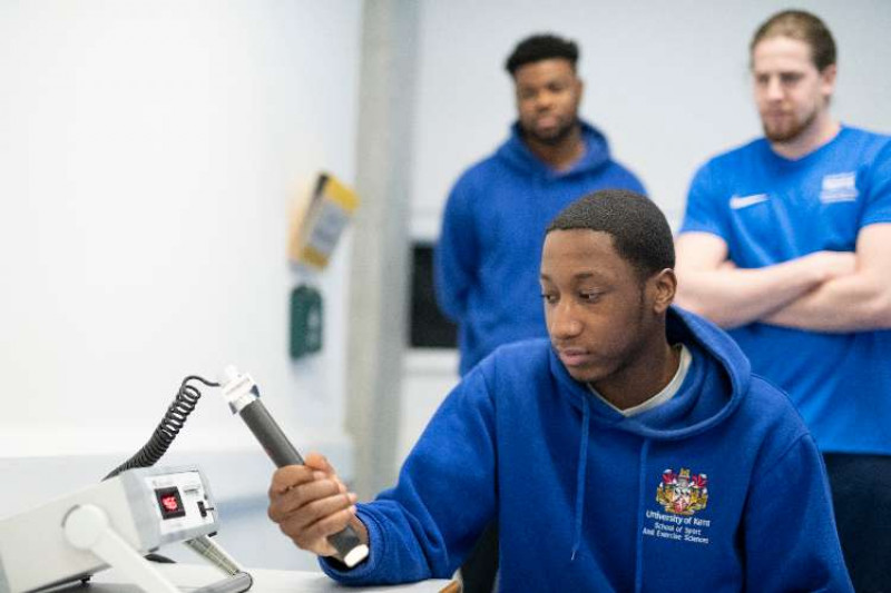 Student using a hand-grip dynamometer.