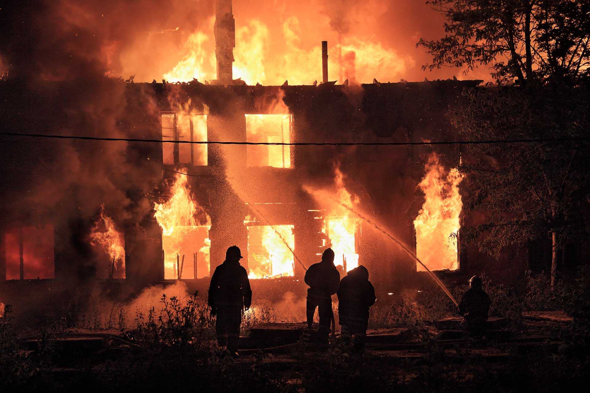 Firefighters tackling a burning building