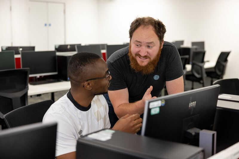 staff and student talking
