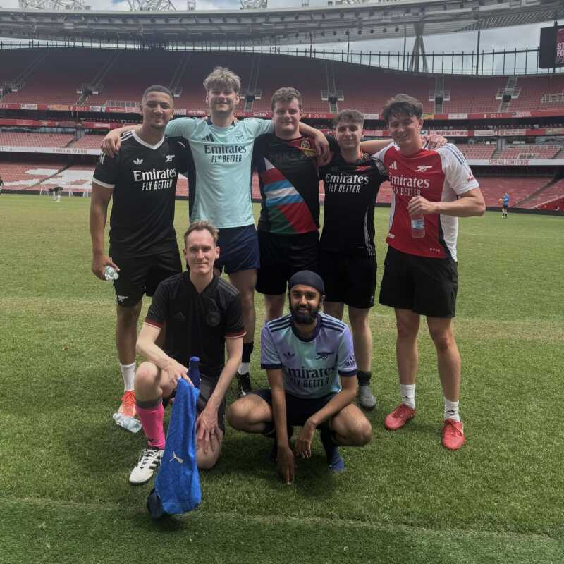 Ben Hopker and people on a football pitch