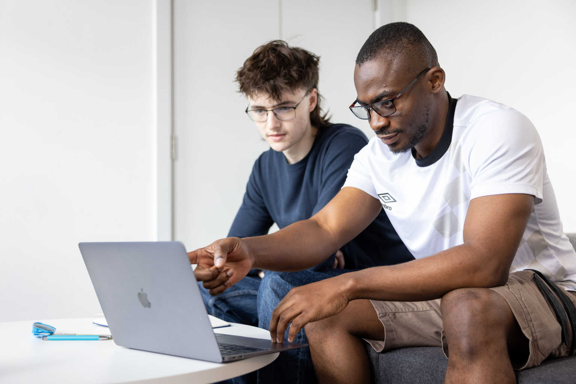 Student sat with headphones around neck