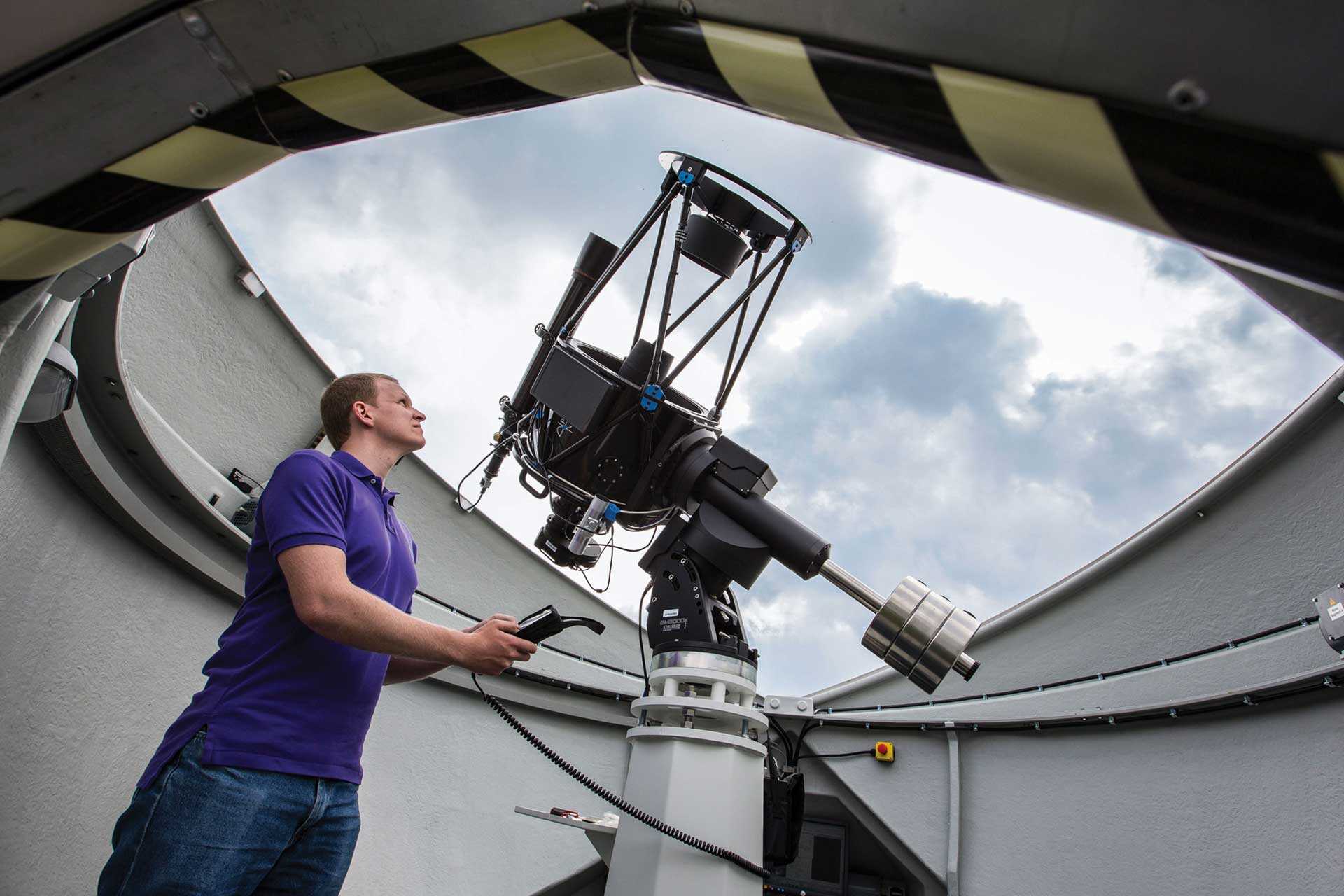 A student using a telescope