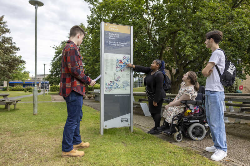 Image shows students look at a map on the Canterbury Campus
