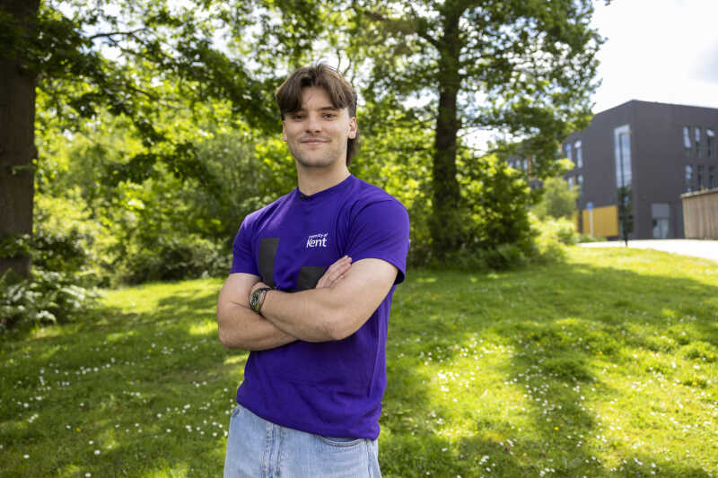 Image of a student smiling and looking at the camera