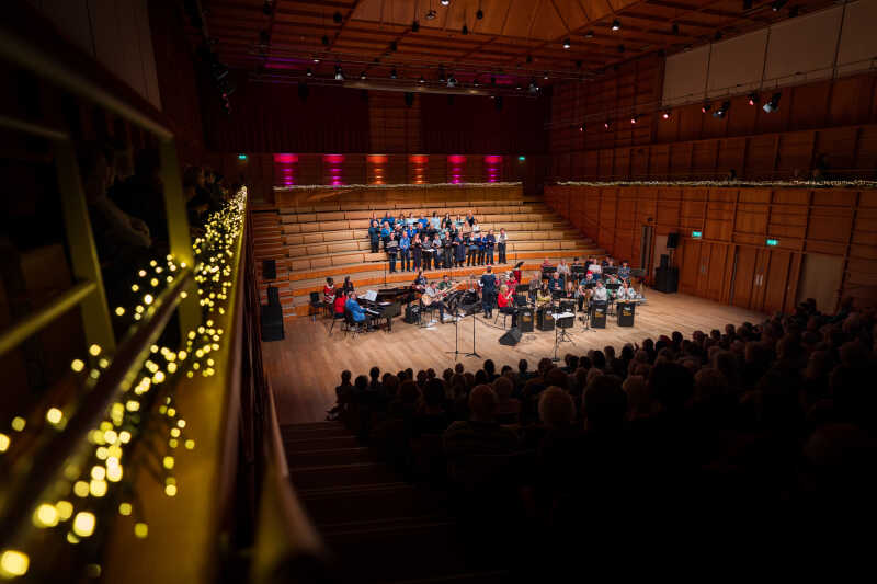Group of jazz musicians playing in a concert-hall