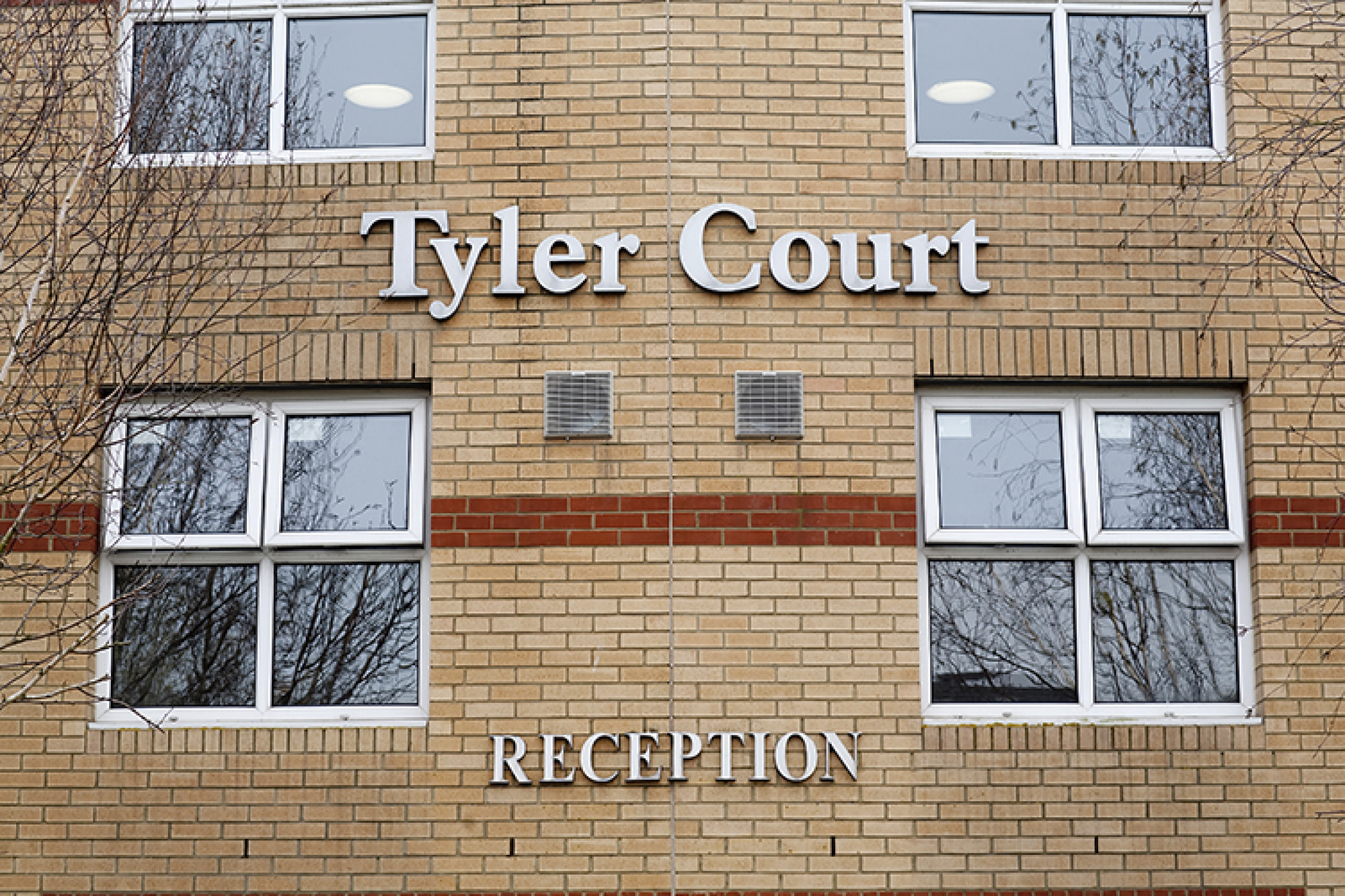 Tyler Court external wall with sign for reception