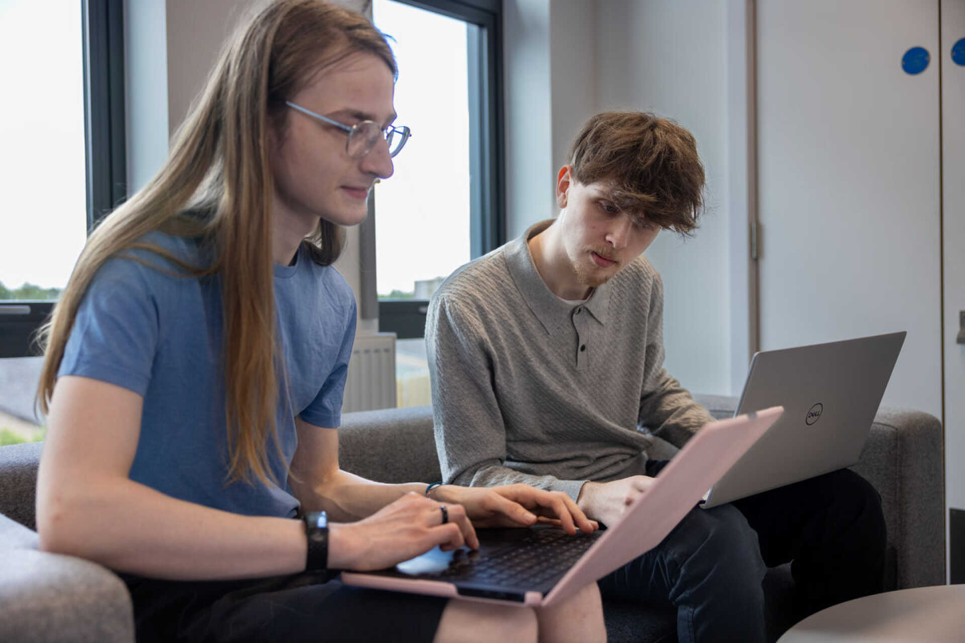 Students looking at laptops