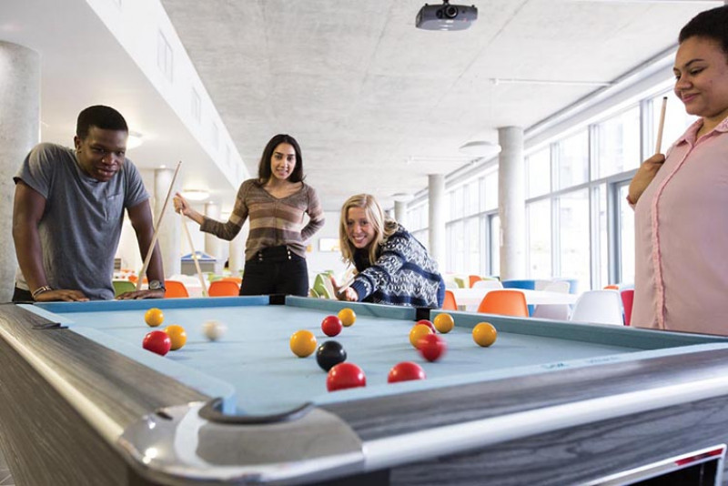 Students playing pool in Hut 8 catering outlet