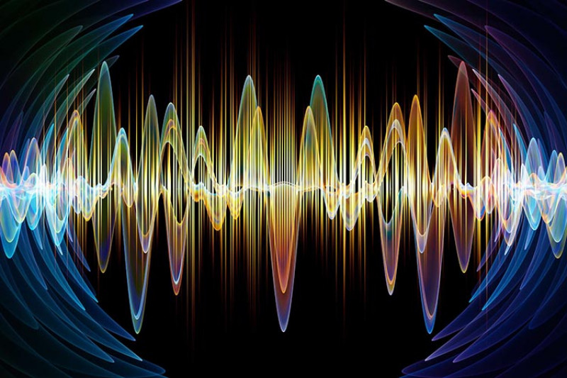 Yellow and white sound waves on a black background