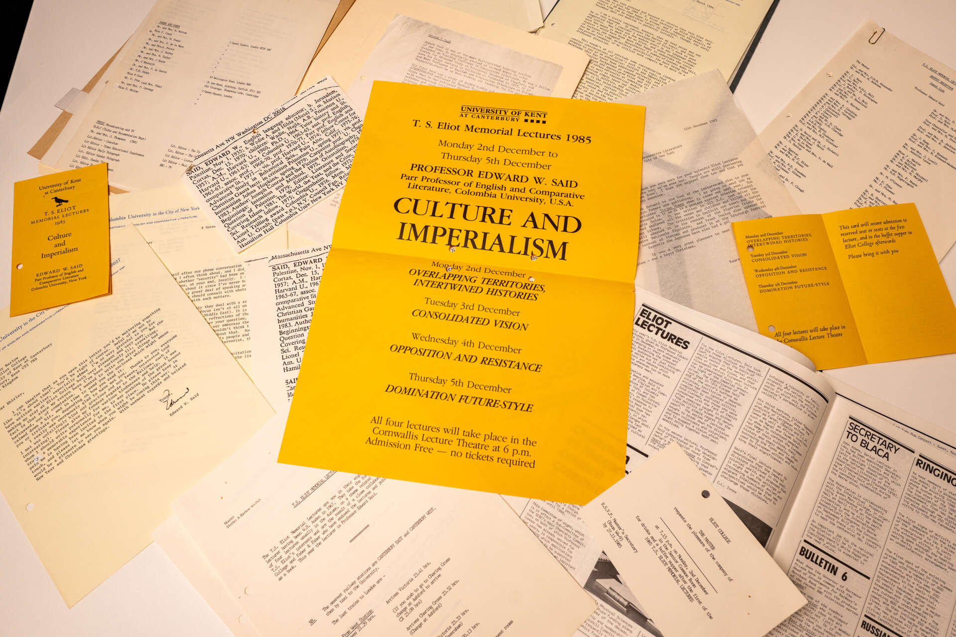 display of materials at symposium - papers and books on a desk