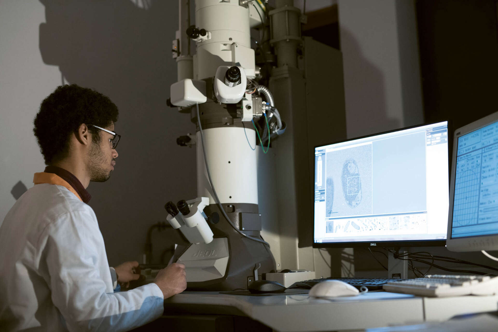 A PhD student using equipment