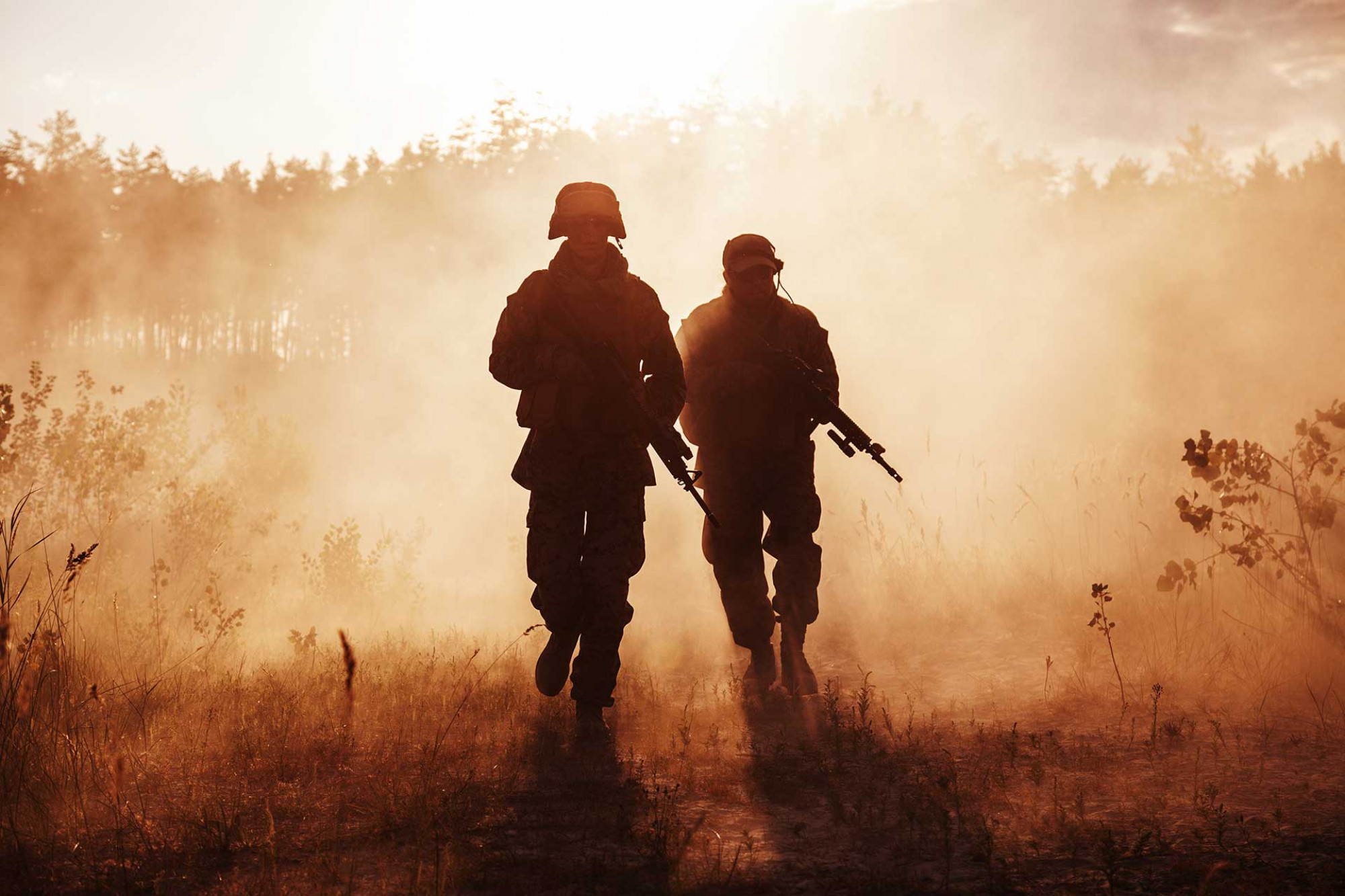 Two US soldiers walking towards camera