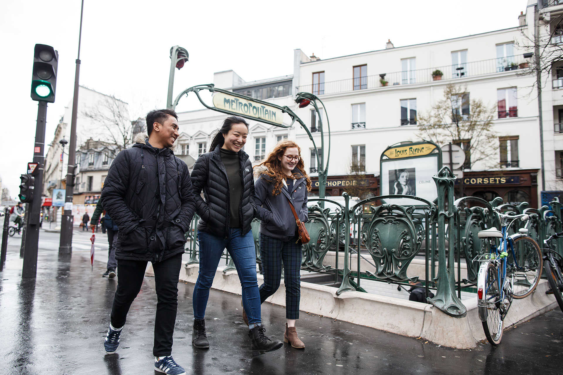 Three students walking down a Paris street