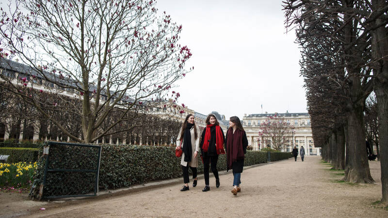 A group of students walking through a Paris park