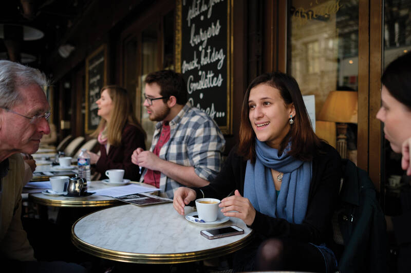 Mixed group of students in Paris café