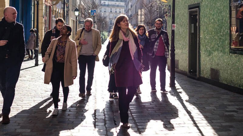 Students and academic staff walking through Paris
