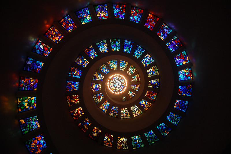 Stained glass spiral with circle of lights in the centre