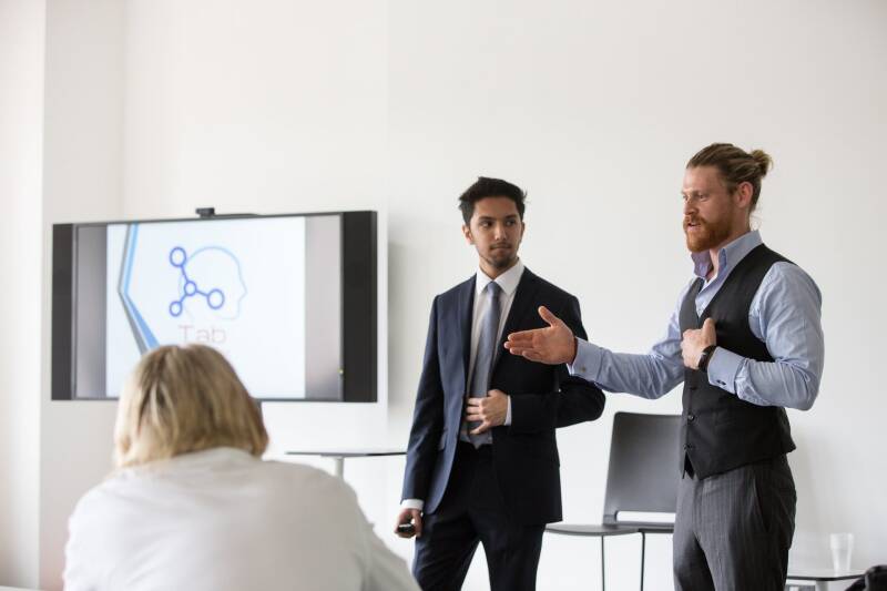 Two students giving a presentation