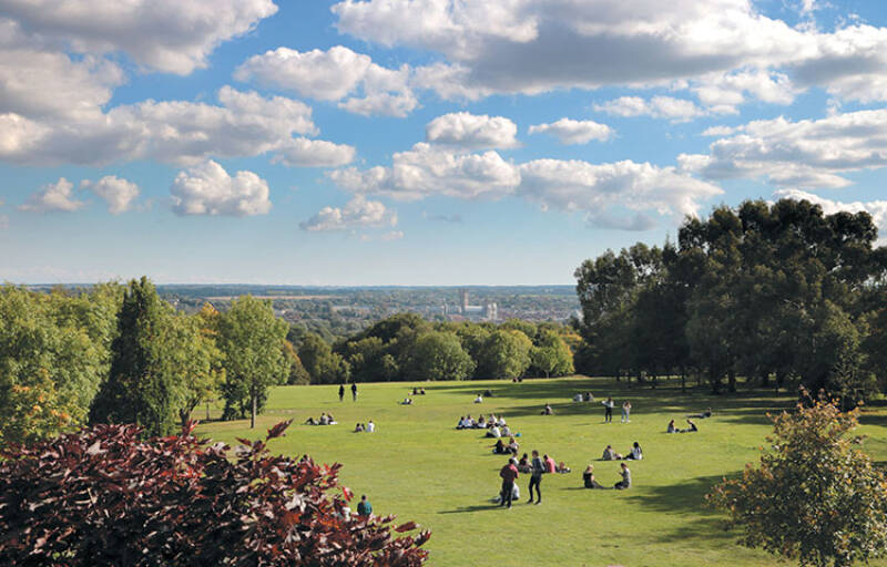 Students on the lawns at Canterbury campus overlooking the city