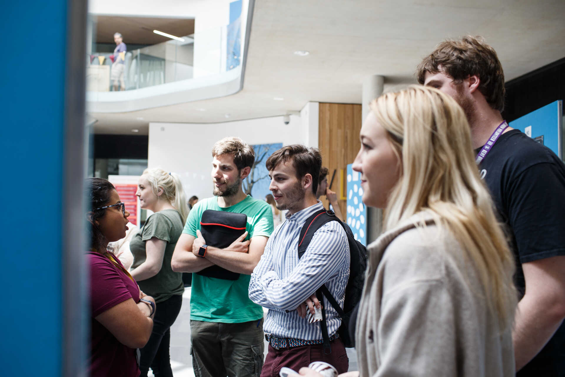 Group talking at poster display