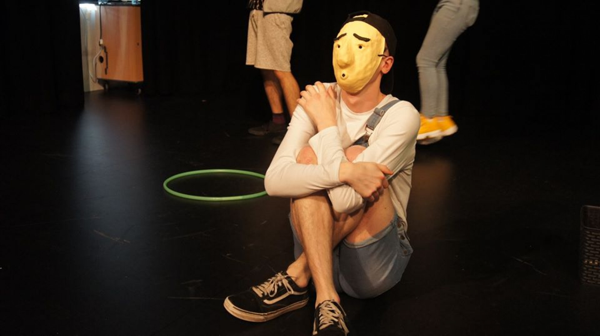 Student poses in mask
