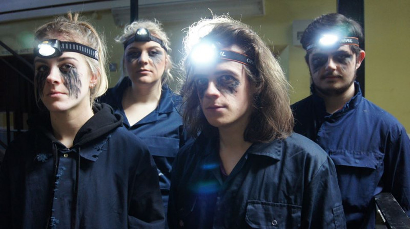 Students with headlamps and sinister make-up.
