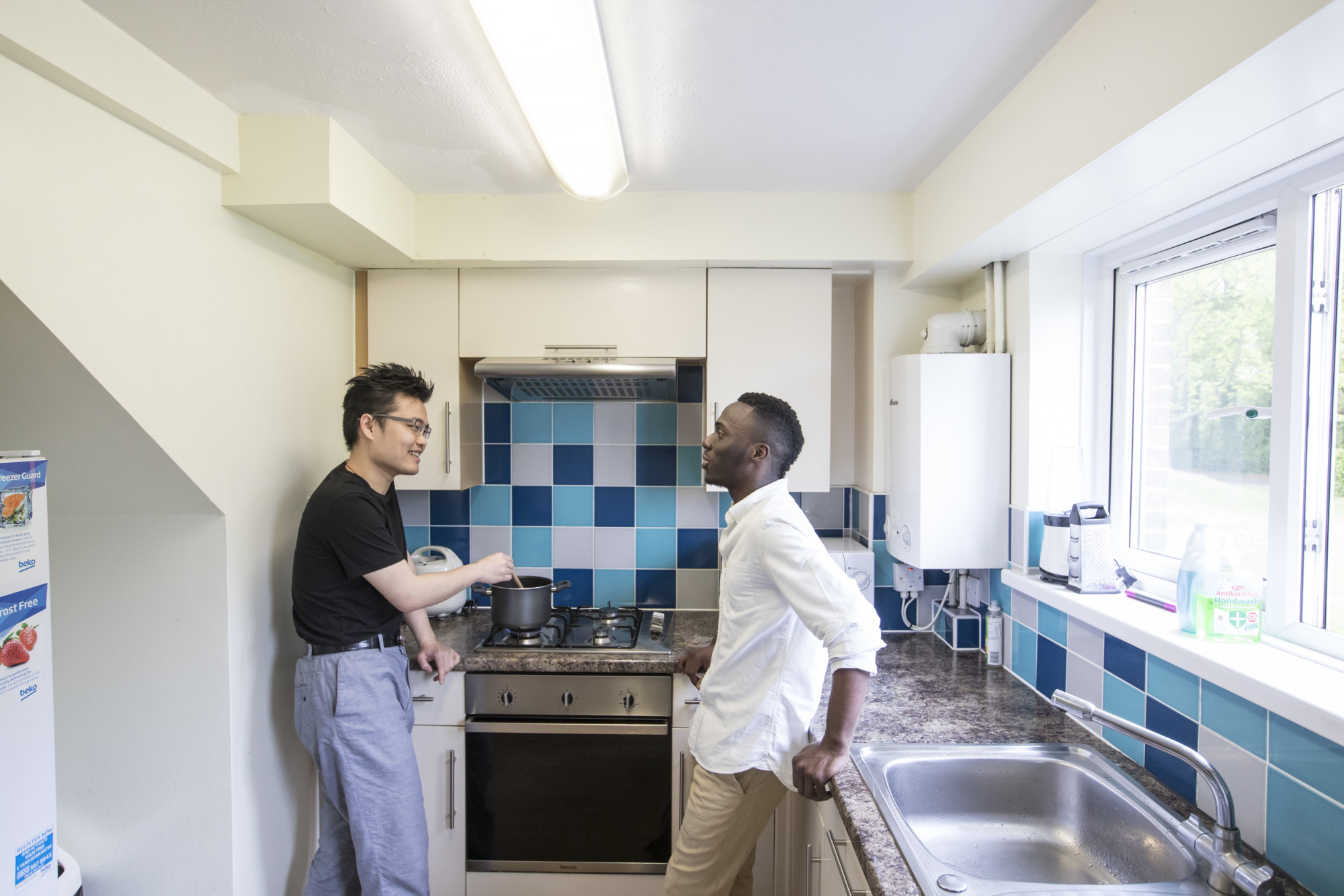 Two male students in a Darwin House kitchen
