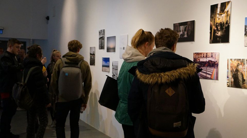 Students looking around a photography exhibition.