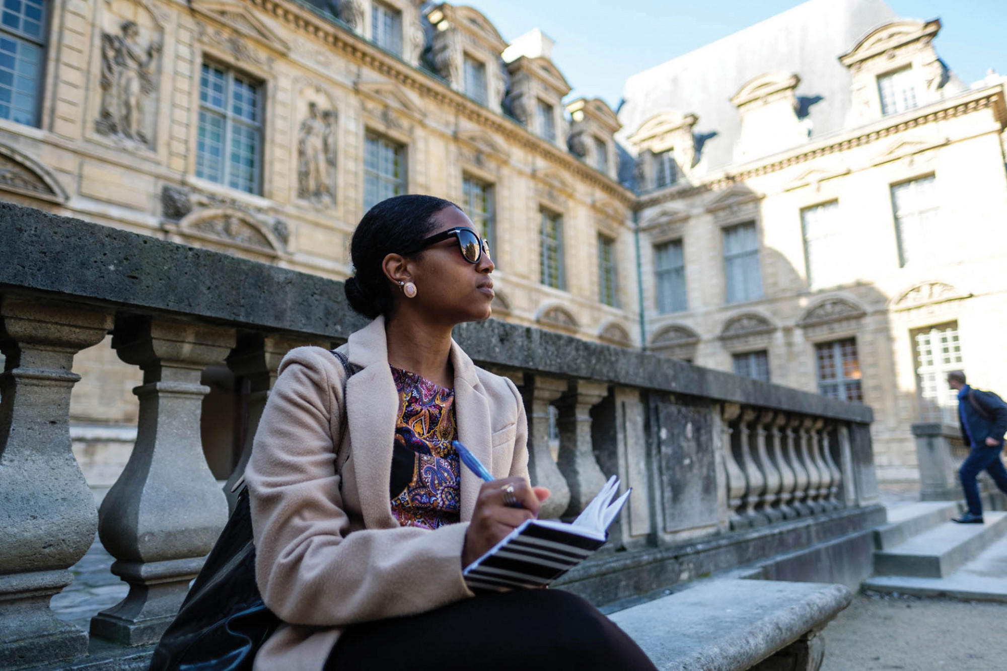 Woman with notebook in Paris